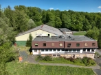 Drohnenaufnahme ehemaliges Hotel - Attraktives Baugrundstück in Bestlage von Ransbach-Baumbach – Planungsvorschlag für 69 Wohneinheiten