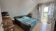 Schlafzimmer OG - Ihr neues Zuhause am Ortsrand – modernes Massivhaus mit Kamin & sonnigem Garten