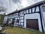 Außenansicht - Immobilie mit Charakter: Vielseitiges Wohnhaus mit ehemaligem Café und 3 Wohneinheiten